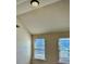 Bedroom with vaulted ceiling and two windows bringing in natural light at 611 Winners Cir, Locust Grove, GA 30248