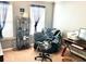 Bright bedroom featuring two windows, a desk, comfy chair and Cowboys decor at 611 Winners Cir, Locust Grove, GA 30248