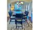 Dining room featuring a table, six chairs, and decorative area rug at 611 Winners Cir, Locust Grove, GA 30248