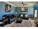 Inviting living room with modern decor, comfortable seating, soft carpet and plenty of natural light at 611 Winners Cir, Locust Grove, GA 30248
