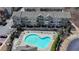 Aerial view of townhomes with a community pool and lounge area at 656 Sunset Park Dr, Suwanee, GA 30024