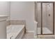 Modern bathroom with a soaking tub and a glass-enclosed shower at 656 Sunset Park Dr, Suwanee, GA 30024