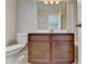 Bathroom featuring a vanity with dark cabinets and a white countertop at 656 Sunset Park Dr, Suwanee, GA 30024