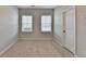 Bedroom showcasing two windows and neutral walls and carpeting at 656 Sunset Park Dr, Suwanee, GA 30024