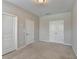 Bedroom with two closets and neutral carpet at 656 Sunset Park Dr, Suwanee, GA 30024