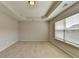 Bedroom with a large window and neutral carpet at 656 Sunset Park Dr, Suwanee, GA 30024