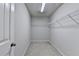 Spacious walk-in closet includes shelving for storage and organization at 656 Sunset Park Dr, Suwanee, GA 30024