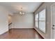 Bright dining area with hardwood floors and natural light from windows and door at 656 Sunset Park Dr, Suwanee, GA 30024