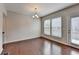 Bright dining area with hardwood floors and natural light from windows and door at 656 Sunset Park Dr, Suwanee, GA 30024
