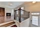 Inviting entryway featuring hardwood floors, staircase with dark wood railing, and natural light at 656 Sunset Park Dr, Suwanee, GA 30024