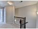 Upstairs hallway with carpet and traditional wood railing on the stairway at 656 Sunset Park Dr, Suwanee, GA 30024