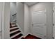 Hallway with wood floors and a staircase to the second floor at 656 Sunset Park Dr, Suwanee, GA 30024