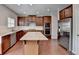 Modern kitchen with granite countertops, stainless steel appliances, and center island at 656 Sunset Park Dr, Suwanee, GA 30024
