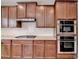 Kitchen featuring granite countertops, stainless steel appliances, and tiled backsplash at 656 Sunset Park Dr, Suwanee, GA 30024