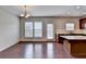 Eat-in kitchen with stainless steel appliances, granite countertops, and hardwood floors at 656 Sunset Park Dr, Suwanee, GA 30024