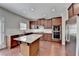 Modern kitchen with granite countertops, stainless steel appliances, and center island at 656 Sunset Park Dr, Suwanee, GA 30024