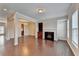 Spacious living room with hardwood floors, fireplace, and plenty of natural light at 656 Sunset Park Dr, Suwanee, GA 30024