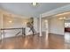 Bright, open-concept living room with hardwood floors and easy access to the kitchen at 656 Sunset Park Dr, Suwanee, GA 30024