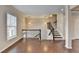 Well-lit living room showcases hardwood floors and a staircase leading upstairs at 656 Sunset Park Dr, Suwanee, GA 30024