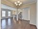 Open-concept living room with hardwood floors and staircase access provides spacious interior at 656 Sunset Park Dr, Suwanee, GA 30024