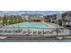 Large community pool with lounge chairs, umbrellas and a covered pavilion at 656 Sunset Park Dr, Suwanee, GA 30024