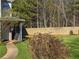 Relaxing backyard with a tall wooden fence that encloses the space and mature plantings at 217 Odyssey Turn Nw, Conyers, GA 30012