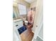 This bathroom includes a toilet, sink, cabinet, mirror, shower and curtain at 217 Odyssey Turn Nw, Conyers, GA 30012