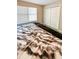 The bedroom features a large window for natural light and ample closet space at 217 Odyssey Turn Nw, Conyers, GA 30012