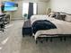 Comfortable main bedroom with plush carpet, neutral décor, a television, and a large window at 217 Odyssey Turn Nw, Conyers, GA 30012