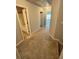 Hallway with carpet flooring leading to a bedroom and bathroom at 3181 Meadowstone Ln, Atlanta, GA 30331