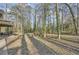 Backyard with lots of trees and a view of the deck area at 4716 Habersham Sw Rdg, Lilburn, GA 30047