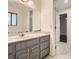 Updated bathroom with gray vanity, white countertop, and a view to the adjacent bedroom at 4716 Habersham Sw Rdg, Lilburn, GA 30047