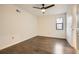 Bright bedroom with hardwood floors, ceiling fan, and window with natural light at 4716 Habersham Sw Rdg, Lilburn, GA 30047