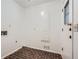 Functional laundry room with brick floors and a door leading to the exterior at 4716 Habersham Sw Rdg, Lilburn, GA 30047