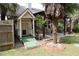 Backyard features a charming playhouse and patio, perfect for Gathering enjoyment at 1313 Idlewood Ct, Mcdonough, GA 30252