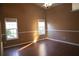 Spacious bedroom with hardwood flooring, two windows, ceiling fan and neutral paint at 1313 Idlewood Ct, Mcdonough, GA 30252