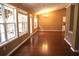 Inviting living room featuring gleaming hardwood floors and plenty of natural light from large windows at 1313 Idlewood Ct, Mcdonough, GA 30252