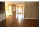 View of spacious living room with hardwood flooring and front entryway at 1313 Idlewood Ct, Mcdonough, GA 30252