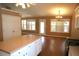 Bright living room and kitchen area filled with natural light and hardwood floors at 1313 Idlewood Ct, Mcdonough, GA 30252