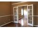 Office space with French doors and beautiful hardwood floors, perfect for work at 1313 Idlewood Ct, Mcdonough, GA 30252