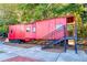 A vintage red rail car welcomes visitors to the Southern Museum grounds at 1923 Deco Dr, Kennesaw, GA 30144
