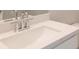 Close-up of vanity in bathroom with white countertop and shiny faucet at 1923 Deco Dr, Kennesaw, GA 30144