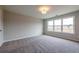 Bright, carpeted bedroom with recessed lighting and a large bank of windows at 1923 Deco Dr, Kennesaw, GA 30144