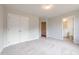 Bedroom with carpeted flooring, large closet, and a view into the bathroom at 1923 Deco Dr, Kennesaw, GA 30144