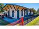 Exterior of a vintage-style train depot with intricate trim and blue accents on a sunny day at 1923 Deco Dr, Kennesaw, GA 30144