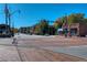Street intersection featuring brick-paved roads, pedestrian crosswalks, and commercial buildings at 1923 Deco Dr, Kennesaw, GA 30144