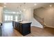 Open-concept kitchen with a large island, stainless steel appliances, and lots of natural light at 1923 Deco Dr, Kennesaw, GA 30144