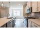 Modern kitchen boasts island, stainless appliances, and recessed lighting at 1923 Deco Dr, Kennesaw, GA 30144