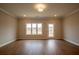 Spacious living room showcasing hardwood floors, natural light, and backyard access at 1923 Deco Dr, Kennesaw, GA 30144