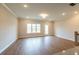 Open living room with hardwood floors, recessed lighting and a lot of natural light at 1923 Deco Dr, Kennesaw, GA 30144